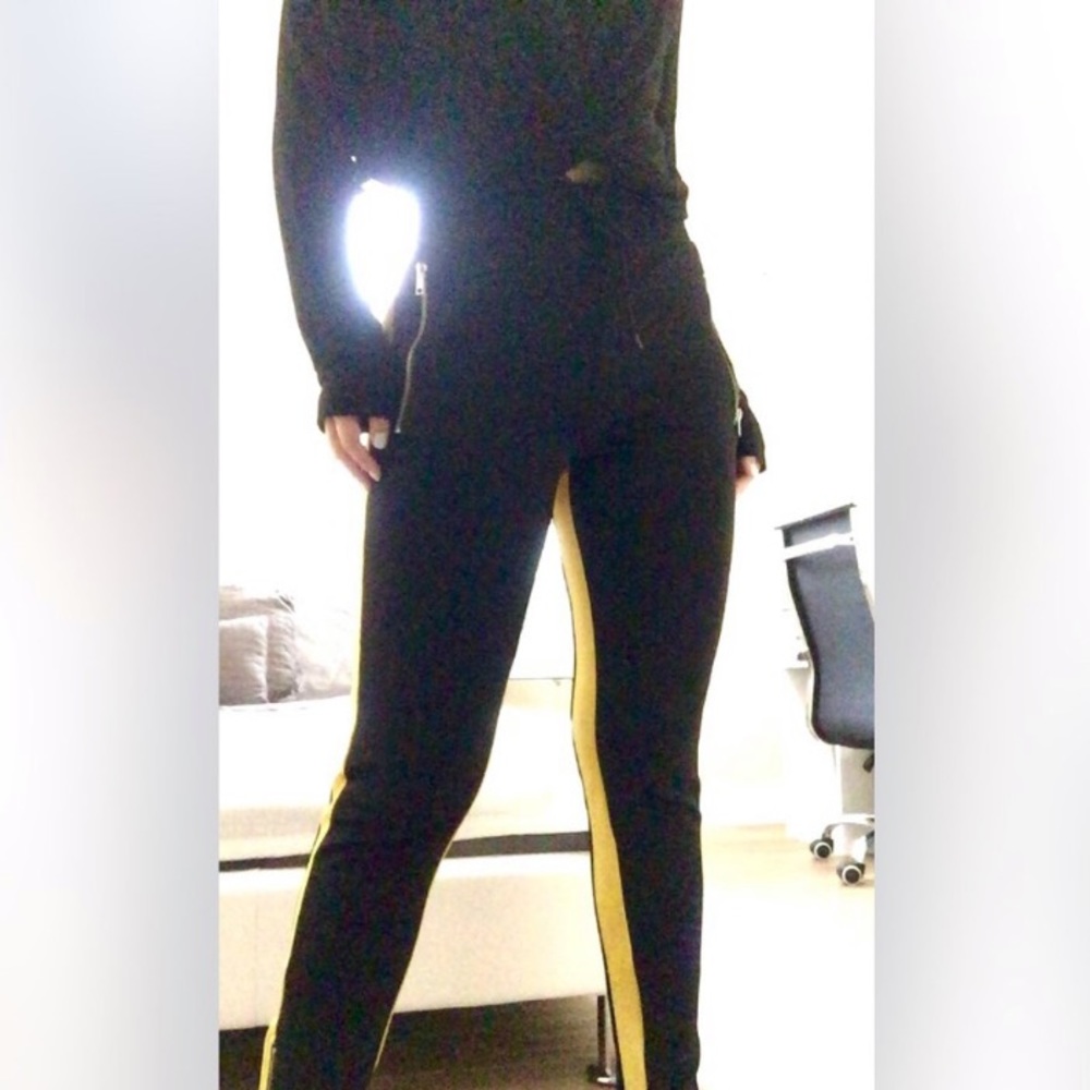 black pants with yellow stripes